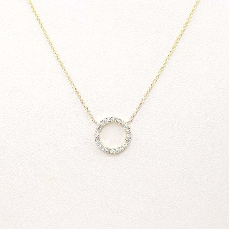 Geometric circular ring with diamond inlay and bangle chain for the collarbone